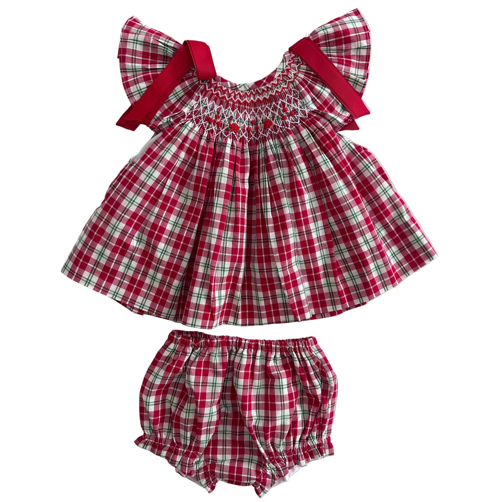 Description:
Our Christmas Tartan Smocked Set is a festive classic designed to bring timeless charm to your little one’s holiday wardrobe. Featuring a beautifully hand-smocked bodice with red and green threadwork over traditional tartan checks, this set perfectly captures the spirit of Christmas. 
🎀 Details:
	•	100% cotton
	•	Hand-smocked detailing on the chest
	•	Festive red and green tartan pattern
	•	Matching bloomers included
	•	Red bow accents
	
