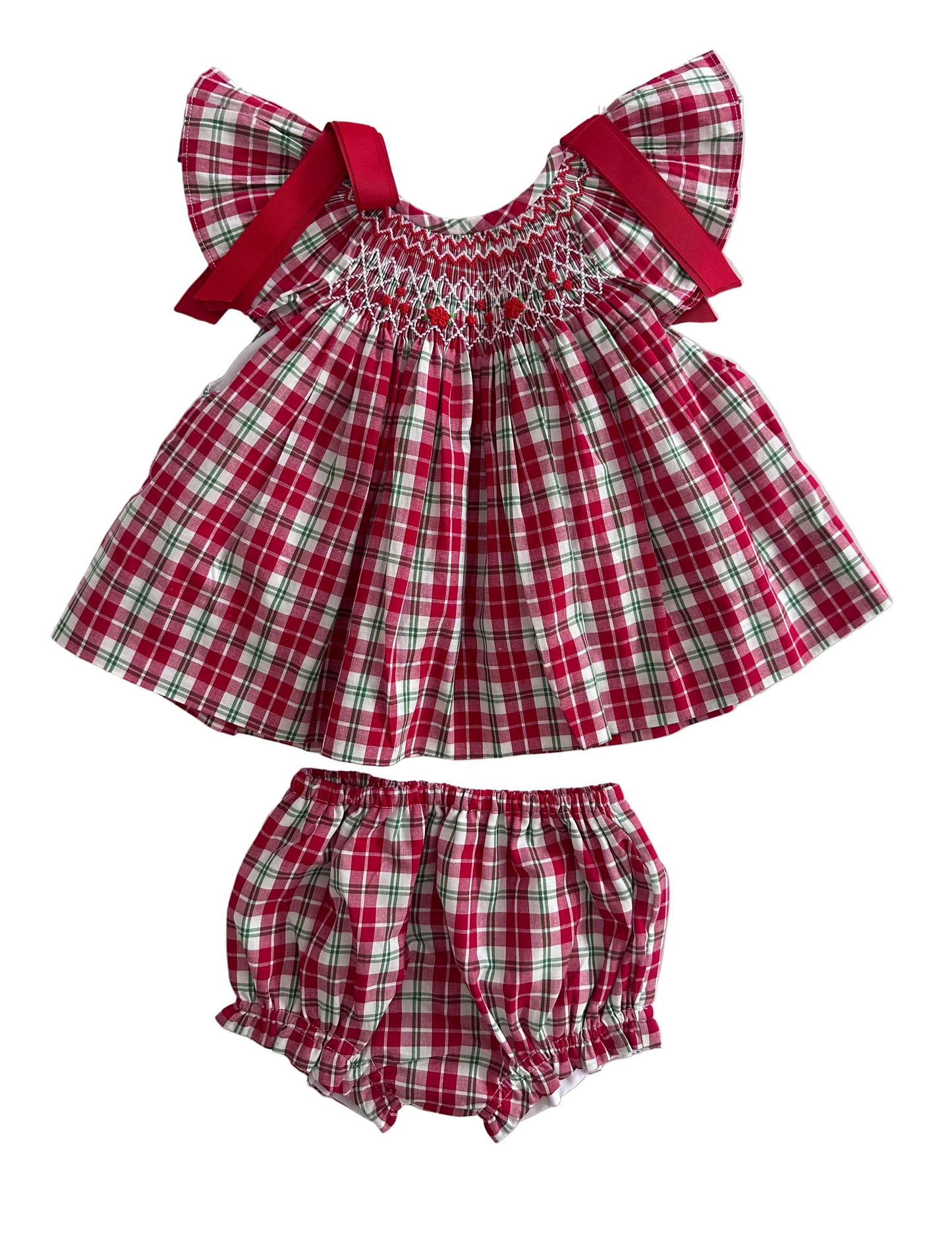 Description:
Our Christmas Tartan Smocked Set is a festive classic designed to bring timeless charm to your little one’s holiday wardrobe. Featuring a beautifully hand-smocked bodice with red and green threadwork over traditional tartan checks, this set perfectly captures the spirit of Christmas. 
🎀 Details:
	•	100% cotton
	•	Hand-smocked detailing on the chest
	•	Festive red and green tartan pattern
	•	Matching bloomers included
	•	Red bow accents
	
