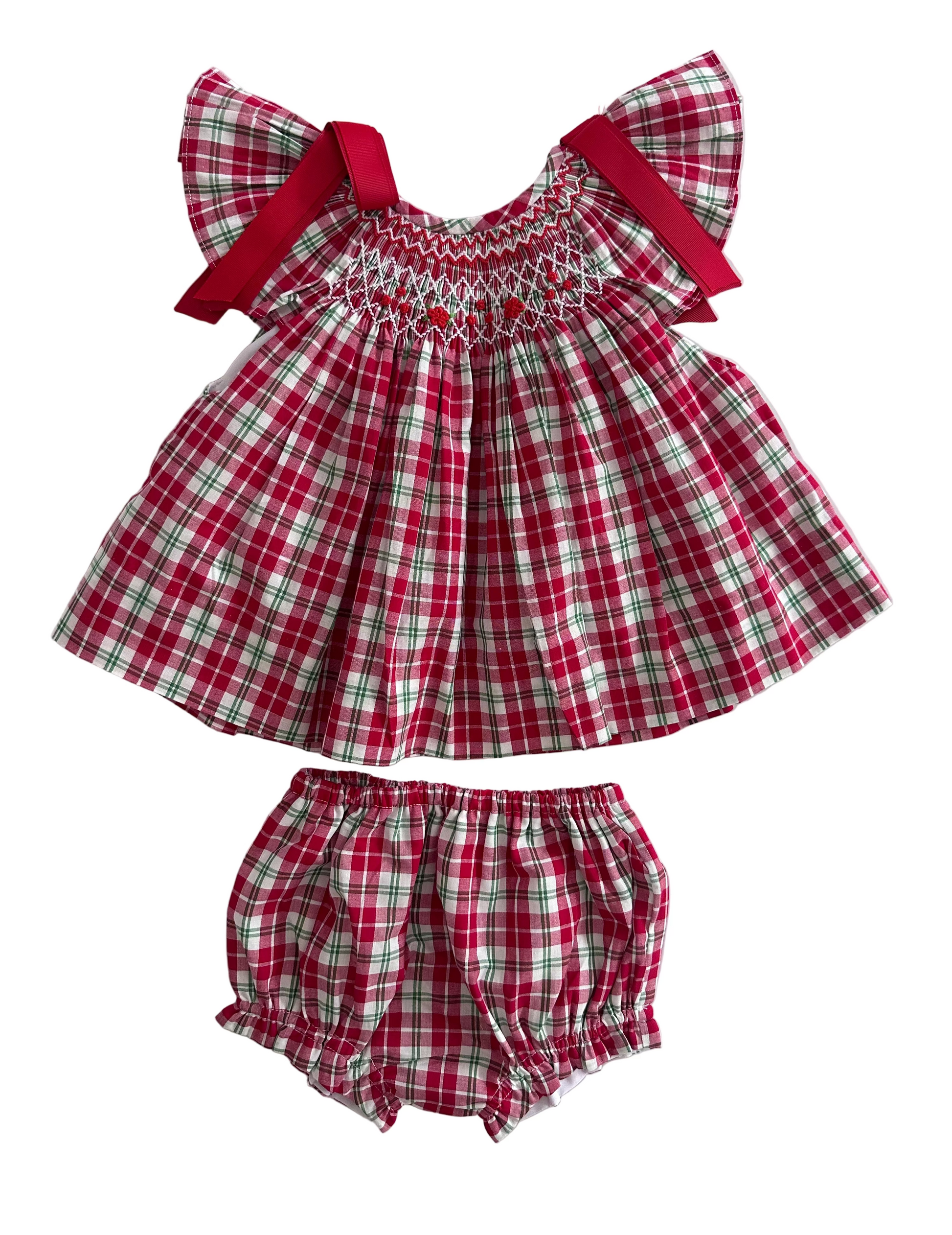 Description:
Our Christmas Tartan Smocked Set is a festive classic designed to bring timeless charm to your little one’s holiday wardrobe. Featuring a beautifully hand-smocked bodice with red and green threadwork over traditional tartan checks, this set perfectly captures the spirit of Christmas. 
🎀 Details:
	•	100% cotton
	•	Hand-smocked detailing on the chest
	•	Festive red and green tartan pattern
	•	Matching bloomers included
	•	Red bow accents
	
