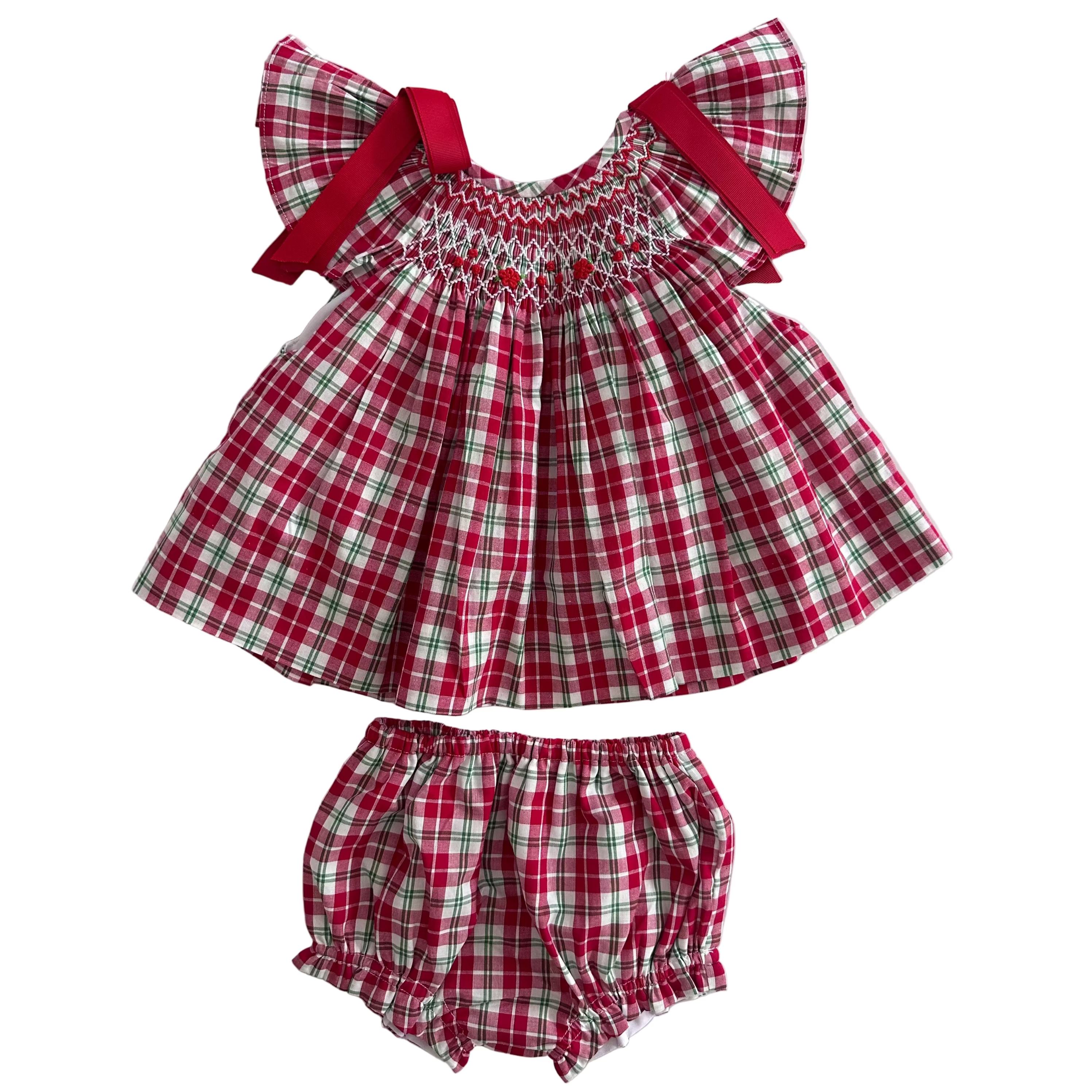 Description:
Our Christmas Tartan Smocked Set is a festive classic designed to bring timeless charm to your little one’s holiday wardrobe. Featuring a beautifully hand-smocked bodice with red and green threadwork over traditional tartan checks, this set perfectly captures the spirit of Christmas. 
🎀 Details:
	•	100% cotton
	•	Hand-smocked detailing on the chest
	•	Festive red and green tartan pattern
	•	Matching bloomers included
	•	Red bow accents
	
